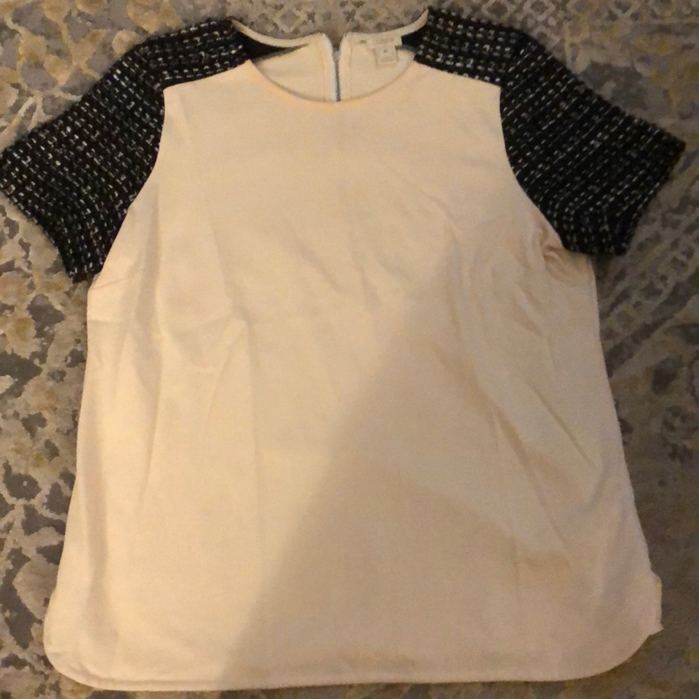 Off white shirt with black sparkly sleeves